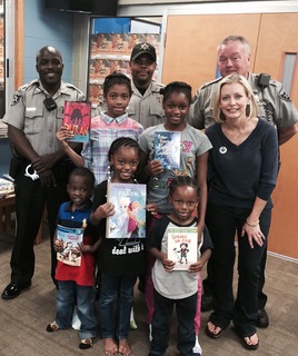 Bibb Sheriff’s Office and Book ‘Em Deliver Books to Children Affected by Hurricane Matthew